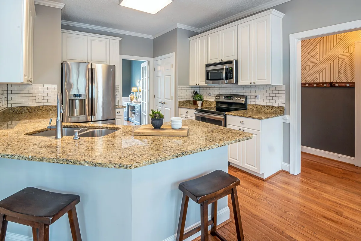 cleaning under kitchen appliances