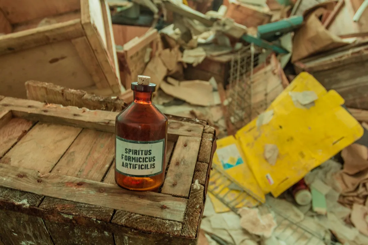 faded peeling pesticide label on old container