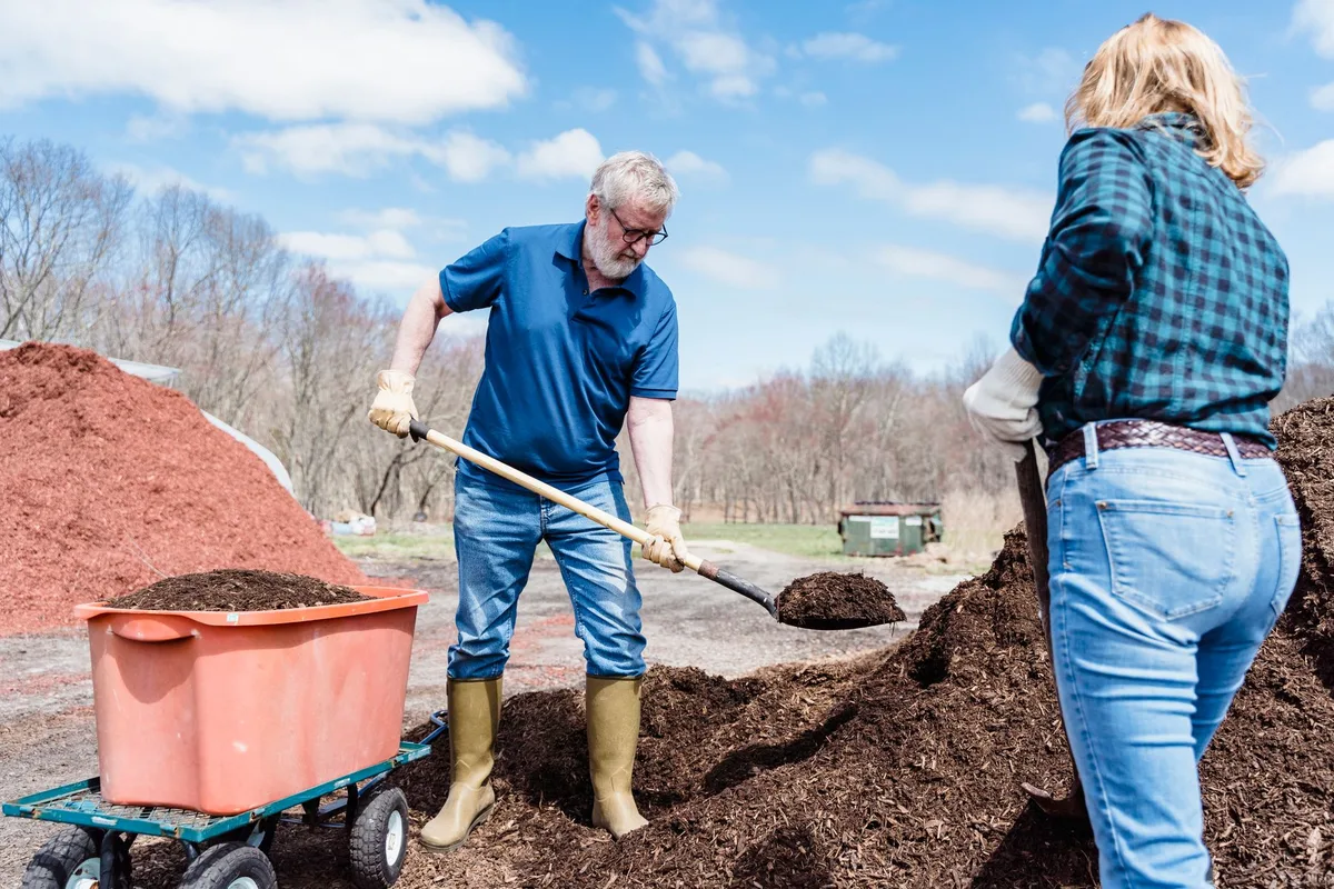 spreading compost on soil